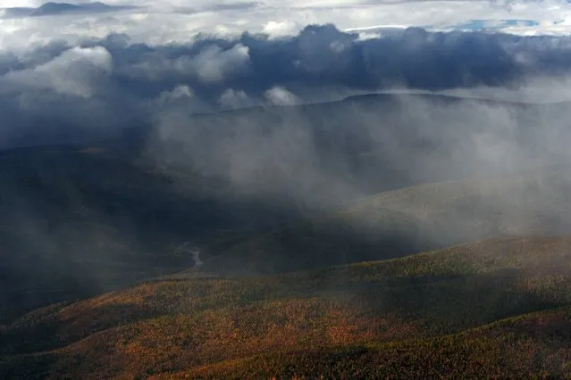 Russia From Above: “Under a Cover of Clouds”. The hills of Taiga in the Beryozovsky district of the Khanty-Mansi Autonomous Area. (Photo by Sergey Fomin)