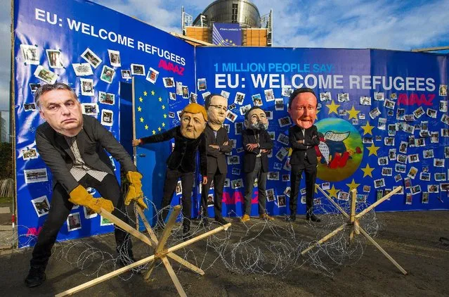 Avaaz's activists wear masks depicting EU leaders (L-R) Hungary's Prime Minister Viktor Orban, Germany's Chancellor Angela Merkel, France's President Francois Hollande, Spain's Prime Minister Mariano Rajo and Britain's Prime Minister David Cameron during a demonstration in Brussels September 14, 2015. Divided European Union justice and home affairs ministers were due to meet on Monday to discuss the migrant crisis. (Photo by Yves Herman/Reuters)