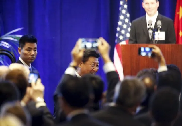 Chinese President Xi Jinping arrives at a dinner reception where he delivers a policy speech to Chinese and United States' CEOs in Seattle, Washington September 22, 2015. Xi landed in Seattle on Tuesday to kick off a week-long U.S. visit that will include meetings with U.S. business leaders, a black-tie state dinner at the White House hosted by President Barack Obama and an address at the United Nations. (Photo by Jason Redmond/Reuters)