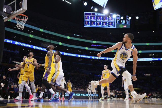 Golden State Warriors guard Stephen Curry, right, watches his shot go in during the first half of an NBA basketball game against the Los Angeles Lakers, Thursday, April 3, 2025, in Los Angeles. (Photo by Mark J. Terrill/AP Photo)
