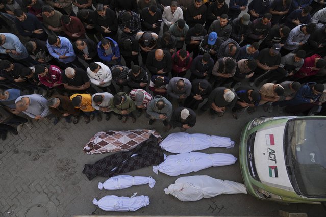Palestinians pray over the bodies of their relatives, who were killed in an Israeli airstrike, at the Baptist Hospital in Gaza City, on Thursday, April 3, 2025. (Photo by Jehad Alshrafi/AP Photo)