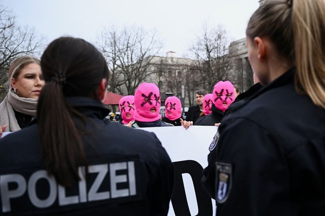 Police officers stop members of Russian activist and artists group p*ssy Riot as they protest in front of the Russian embassy following the death of Russian opposition leader Alexei Navalny, in Berlin, Germany, on February 18, 2024. (Photo by Annegret Hilse/Reuters)