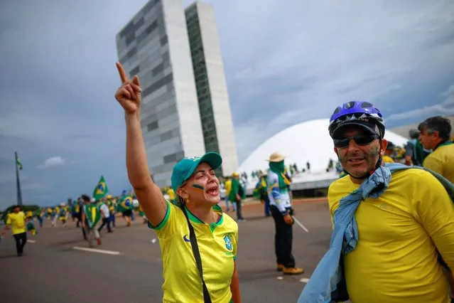 Supporters of Brazil's former President Jair Bolsonaro demonstrate against President Luiz Inacio Lula da Silva, outside Brazil’s National Congress in Brasilia, Brazil, December 8, 2023. (Photo by Adriano Machado/Reuters)