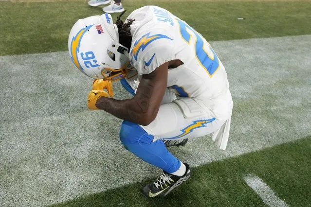 Los Angeles Chargers cornerback Asante Samuel Jr. (26) takes a moment after an NFL wild-card football game against the Jacksonville Jaguars, Saturday, January 14, 2023, in Jacksonville, Fla. Jacksonville Jaguars won 31-30. (Photo by Chris O'Meara/AP Photo)