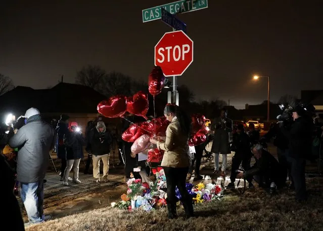 People attend a vigil at the intersection of Castlegate Lane and Bear Creek Cove, where Nichols was beaten by Memphis Police officers, in Memphis, Tennessee, U.S. January 30, 2023. (Photo by Alyssa Pointer/Reuters)