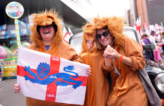 Fans of England dressed as lions pose for a photo while holding their national flag which features a lion emblem on prior to the UEFA Women's EURO 2025 Final match between England and Spain at St. Jakob-Park on July 27, 2025 in Basel, Switzerland. (Photo by Aitor Alcalde – UEFA/UEFA via Getty Images)
