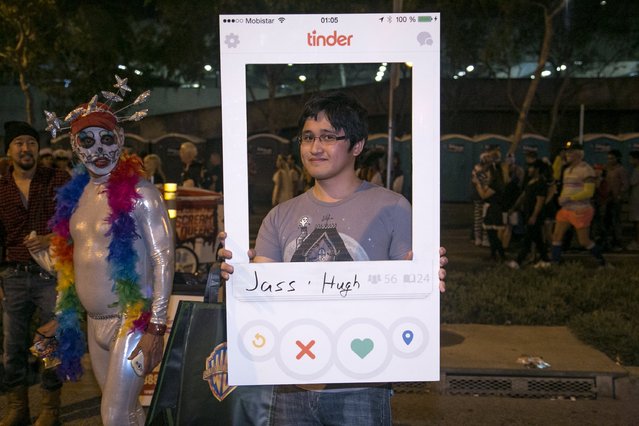 Joel Balcita shows his homemade Tinder App costume at the West Hollywood Halloween Costume Carnaval, which attracts nearly 500,000 people annually, in West Hollywood, California October 31, 2015. (Photo by Jonathan Alcorn/Reuters)