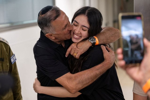 Noa Argamani, one of the four hostages that Israeli forces rescued from Hamas on Saturday, June 8, 2024, embraces her father, Yakov, later that day in Ramat Gan, Israel. She was rescued eight months after being kidnapped by Hamas during the Nova music festival on October 7. (Photo by Israeli Army/Handout via Reuters)