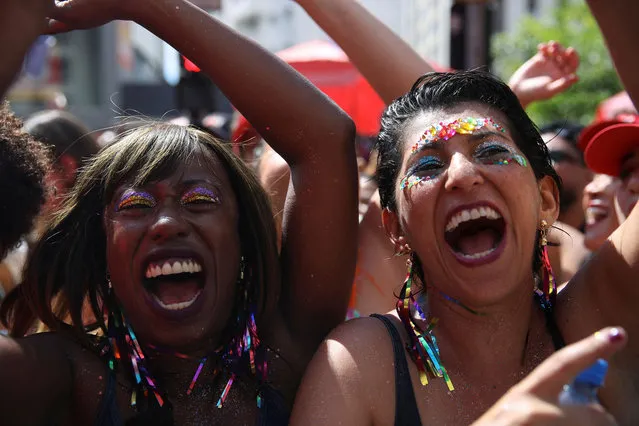 Revellers take part in the “Academicos do Baixo Augusta” block party during a pre-carnival parade in Sao Paulo, Brazil on February 12, 2023. (Photo by Carla Carniel/Reuters)