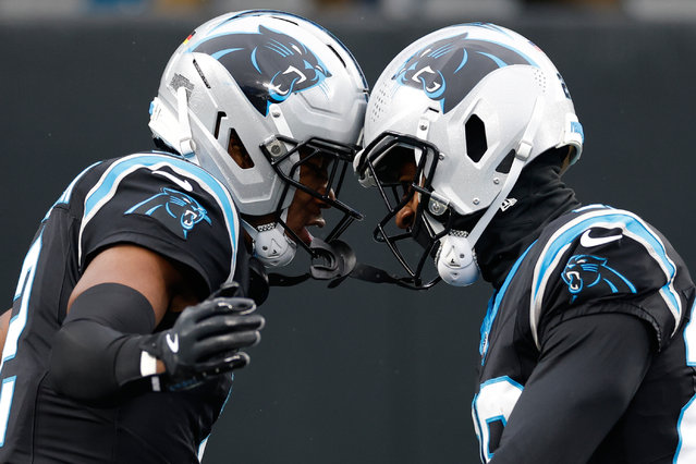 Carolina Panthers cornerback Mike Jackson, left, celebrates his touchdown against the Los Angeles Rams with cornerback Akayleb Evans in the first half of an NFL football game, November 30, 2025, in Charlotte, N.C. (Photo by Rusty Jones/AP Photo)