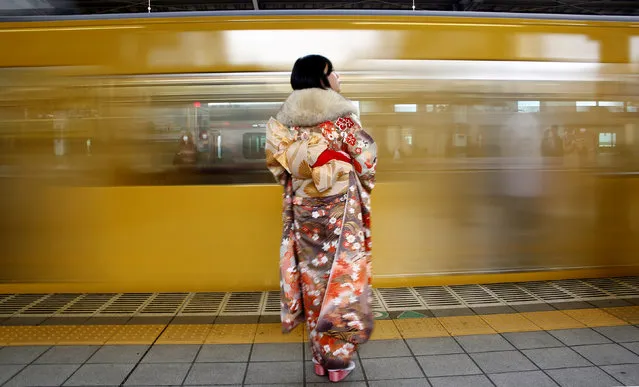 A Japanese woman wearing a kimono waits for her train after Coming of Age Day celebration ceremony in Tokyo, Japan January 9, 2017. (Photo by Kim Kyung-Hoon/Reuters/File Photo)