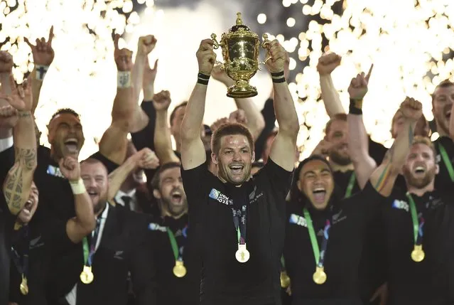 Captain Richie McCaw of New Zealand holds up the Webb Ellis Cup after winning the Rugby World Cup Final against Australia at Twickenham in London, Britain, October 31, 2015. (Photo by Toby Melville/Reuters)