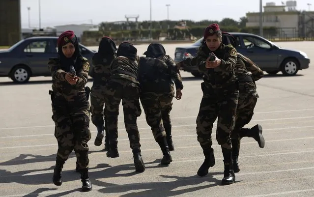 Female members of the Palestinian presidential guard demonstrate their skills during a training session in the West Bank city of Jericho February 10, 2015. (Photo by Mohamad Torokman/Reuters)