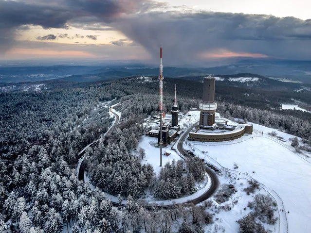 The top of the Feldberg mountain is covered with freshly fallen snow near Frankfurt, Germany, Friday, March 19, 2021. (Photo by Michael Probst/AP Photo)