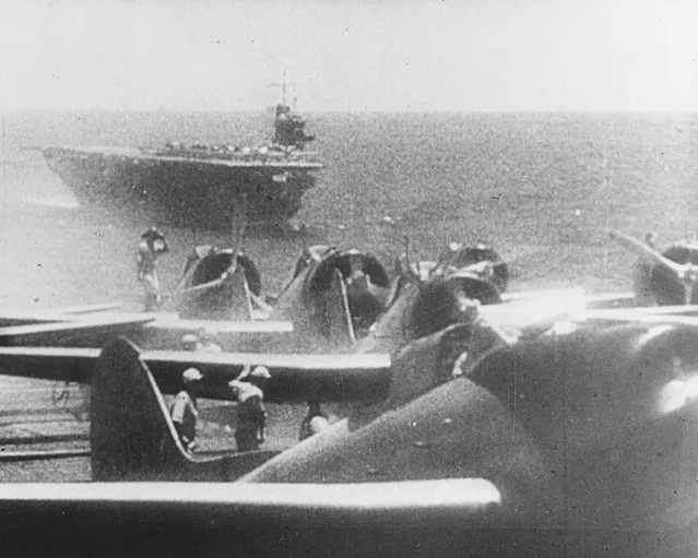 Japanese Navy Type 99 Val carrier bombers prepare to take off from an aircraft carrier to attack Pearl Harbor, Hawaii, U.S. December 7, 1941. The ship in the background is the carrier Soryu. (Photo by Reuters/U.S. Navy/National Archives)