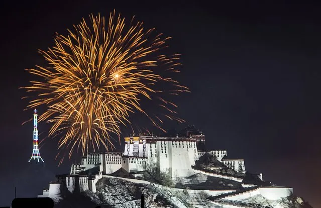 Fireworks explode above the Potala Palace during the celebration of the Tibetan New Year, in Lhasa, Tibet Autonomous Region, February 19, 2015. (Photo by Reuters/Stringer)