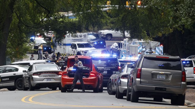 Law enforcement and first responders gather on South Street near the Bell Tower on the University of North Carolina at Chapel Hill campus in Chapel Hill, N.C., Monday, August 28, 2023, after a report of an “armed and dangerous person” on campus. (Photo by Kaitlin McKeown/The News & Observer via AP Photo)