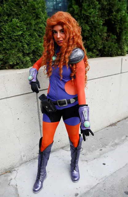 A person dressed up as Starfire attends the 2018 New York Comic Con in Manhattan, New York on October 4, 2018. (Photo by Shannon Stapleton/Reuters)