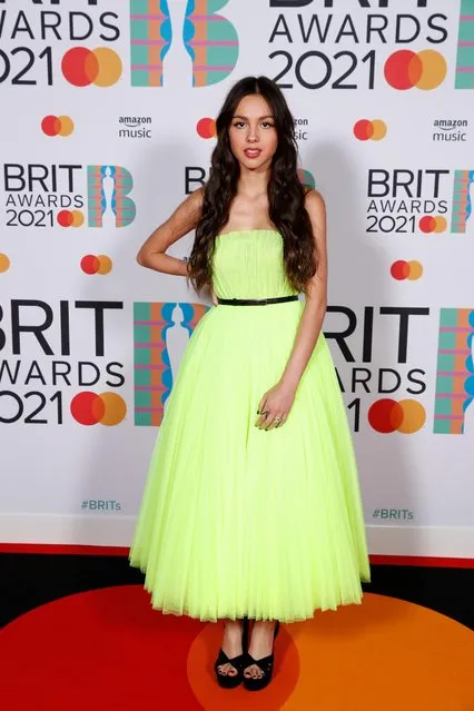 In a handout picture released by the Brit Awards Olivia Rodrigo poses on the red carpet on arrival for the BRIT Awards 2021 in London on May 11, 2021. (Photo by John Marshall/Handout via Reuters)