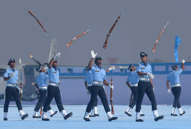 Indian Air Force (IAF) soldiers toss their rifles as they perform during the presentation of President's Standards and Colours to 118 Helicopter Unit and the Air Defence College at Air Force Station in Guwahati, India, November 29, 2018. (Photo by Anuwar Hazarika/Reuters)