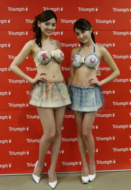 Models present lingerie maker Triumph's new concept bra, the “Omotenashi Compact Bra”, during its unveiling in Tokyo November 28, 2013. (Photo by Toru Hanai/Reuters)