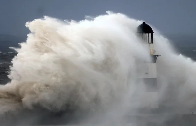 Waves crash against Seaham lighthouse during Storm Babet in Seaham, Britain on October 20, 2023. (Photo by Lee Smith/Reuters)