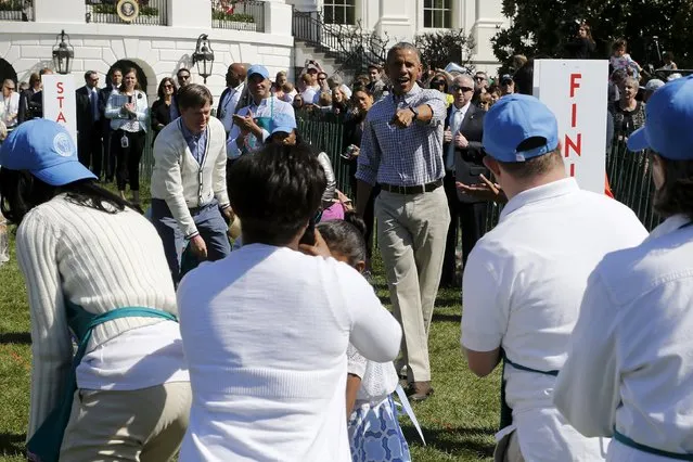 U.S. President Barack Obama presides over a round of egg-rolling during the annual Easter Egg Roll at the White House in Washington April 6, 2015. (Photo by Jonathan Ernst/Reuters)