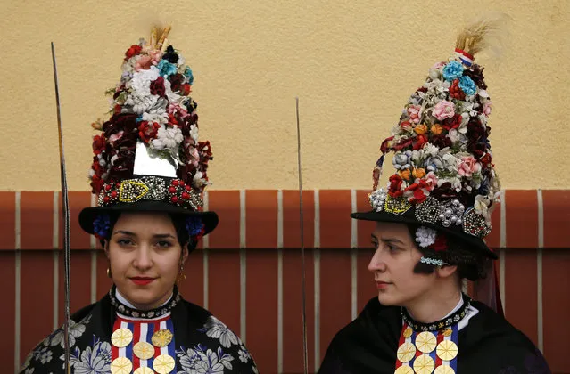 Girls dressed in traditional clothes wait for Camilla, the Duchess of Cornwall (not pictured), at the State Stud Farm in Djakovo, Croatia, March 15, 2016. (Photo by Antonio Bronic/Reuters)