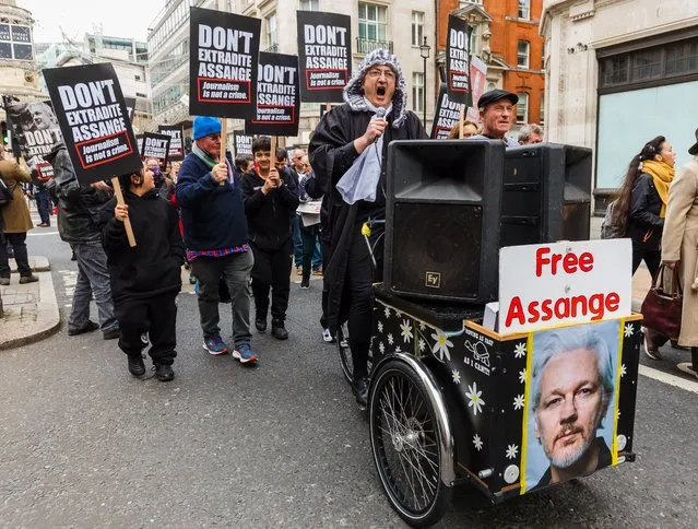 Protesters stage a protest calling for the release of Wikileaks founder Julian Assange, who is on remand and fighting extradition to the United States, outside BBC Broadcasting House in London, Britain, 23 October 2021. Julian Assange is facing extradition to the United States over the publication of secrets relating to the wars in Afghanistan and Iraq. (Photo by Vickie Flores/EPA/EFE)