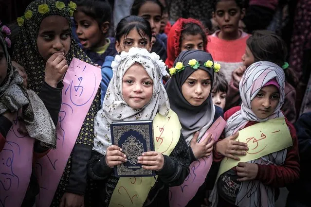 A ceremony is held for 40 students who memorized parts of the Holy Quran at the Shafa Amr School which is used as a shelter for displaced people in Rafah, Gaza on February 14, 2024. (Photo by Belal Khaled/Anadolu via Getty Images)