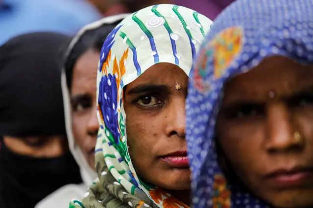 Voters line up to cast their votes outside a polling station during the second phase of general election in Amroha, in the northern Indian state of Uttar Pradesh, India, April 18, 2019. (Photo by Anushree Fadnavis/Reuters)