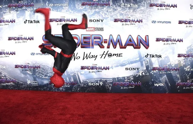 A person dressed as Spider-Man arrives at the premiere of “Spider-Man: No Way Home” at the Regency Village Theater on Monday, December 13, 2021, in Los Angeles. (Photo by Jordan Strauss/Invision/AP Photo)