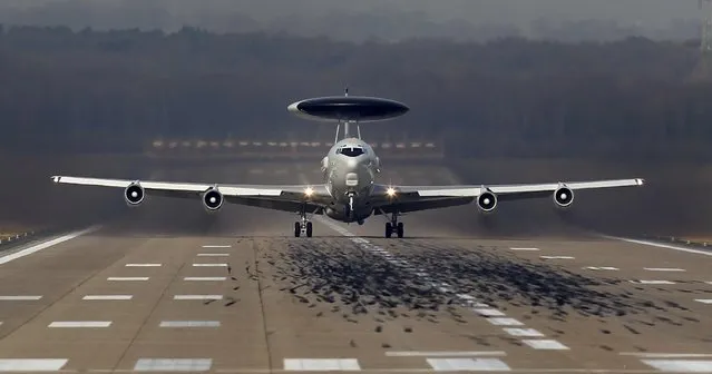 A NATO AWACS (Airborne Warning and Control Systems) aircraft takes-off for a flight to Poland from the AWACS air base in Geilenkirchen near the German-Dutch border April 2, 2014. The NATO alliance said it will start reconnaissance flights with AWACS planes from their home base in Geilenkirchen and Waddington in Britain over Poland and Romania to monitor the situation in neighbouring Ukraine where Russian forces have taken control of Crimea. (Photo by Ina Fassbender/Reuters)