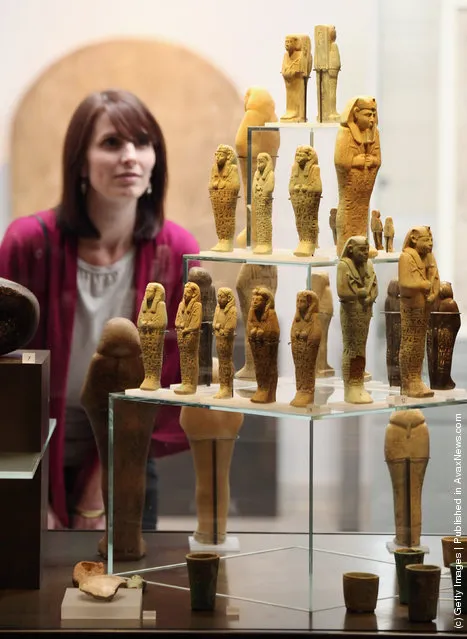 Laura Berry views mummiform figurines on display in the Ashmolean Museum's new exhibition of artifacts from ancient Egypt and Nubia