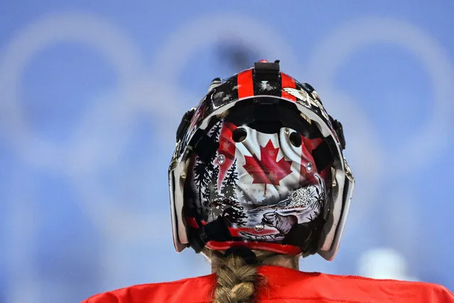 This picture shows the helmet of Canada's goaltender Ann-Renee Desbiens during the women's gold medal match of the Beijing 2022 Winter Olympic Games ice hockey competition between Canada and USA, at the Wukesong Sports Centre in Beijing on February 17, 2022. (Photo by Gabriel Bouys/AFP Photo)
