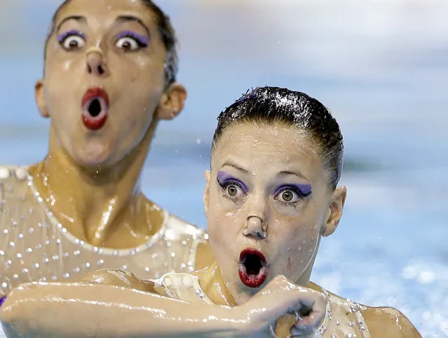 Members of Argentina's synchronized swimming team perform during technical routine competition for the Pan Am Games in Toronto, Thursday, July 9, 2015. (Photo by Gregory Bull/AP Photo)