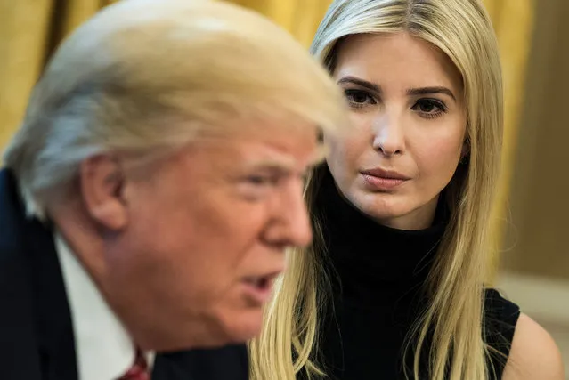 Ivanka Trump listens while her father US President Donald Trump speaks via video with NASA astronauts aboard the International Space Station from the Oval Office of the White House April 24, 2017 in Washington, DC. (Photo by Brendan Smialowski/AFP Photo)