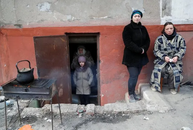 Local residents, who seek refuge in the basement of a building during Ukraine-Russia conflict, are seen in the besieged southern port city of Mariupol, Ukraine on March 17, 2022. (Photo by Alexander Ermochenko/Reuters)