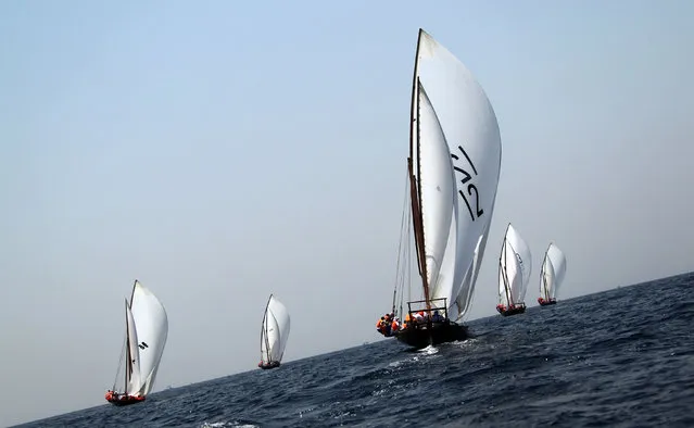 Emiratis sail during the Al-Gaffal 60ft traditional dhow sailing race between the island of Sir Bu Nair, near the Iranian coast, and the Gulf emirate of Dubai on May 28, 2011. (Photo by Karim Sahib/AFP Photo)