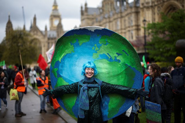 A demonstrator wears a costume as people protest during the Extinction Rebellion's “The Big One” event, in London, Britain on April 21, 2023. (Photo by Henry Nicholls/Reuters)