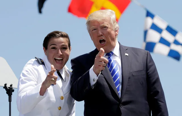 President Trump poses onstage with graduate Erin Reynolds after she received her U.S. Coast Guard Academy diploma during commencement ceremonies in New London, Connecticut on May 17, 2017. (Photo by Kevin Lamarque/Reuters)