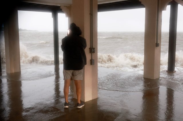 Joey Larsen checks on his neighborhood as high winds, rain and storm surge from Hurricane Debby inundate the area on August 05, 2024, in Cedar Key, Florida. Hurricane Debby brings rain storms and high winds along Florida’s Big Bend area. (Photo by Joe Raedle/Getty Images)