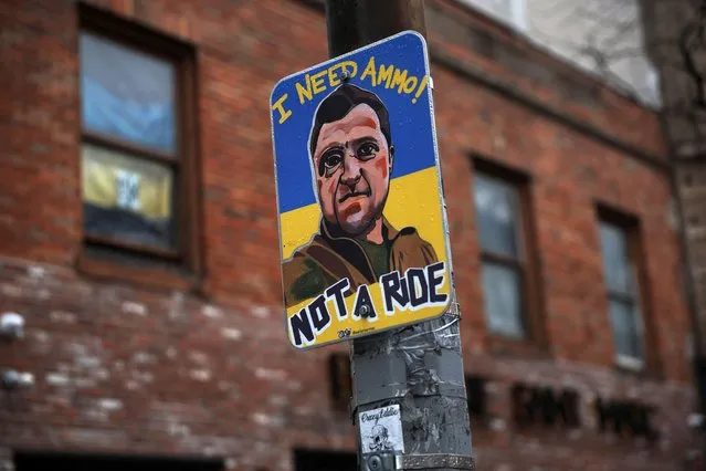 A sign in solidarity with Ukraine is posted on a light pole during the Russian invasion of Ukraine on the Lower East Side of New York City, U.S., March 24, 2022. (Photo by Shannon Stapleton/Reuters)