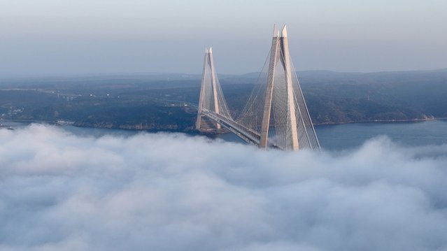 An aerial view of the Yavuz Sultan Selim Bridge as fog blankets it in Istanbul, Turkiye on March 4, 2024. (Photo by Tayyib Hosbas/Anadolu via Getty Images)