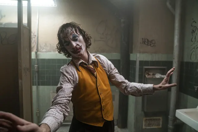 This image released by Warner Bros. Pictures shows Joaquin Phoenix in a scene from “Joker”. The film is nominated for a Golden Globe for best motion picture drama. (Photo by Niko Tavernise/Warner Bros. Pictures via AP Photo)
