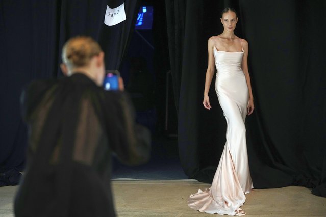 A model poses for a photograph backstage during Moscow Fashion Week in Moscow, Russia, Monday, October 7, 2024. (Photo by Pavel Bednyakov/AP Photo)