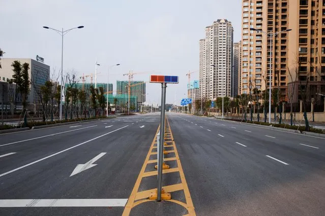 An empty street is seen in Yueyang, Hunan Province, near the border to Hubei Province, which is under partial lockdown, January 28, 2020. (Photo by Thomas Peter/Reuters)