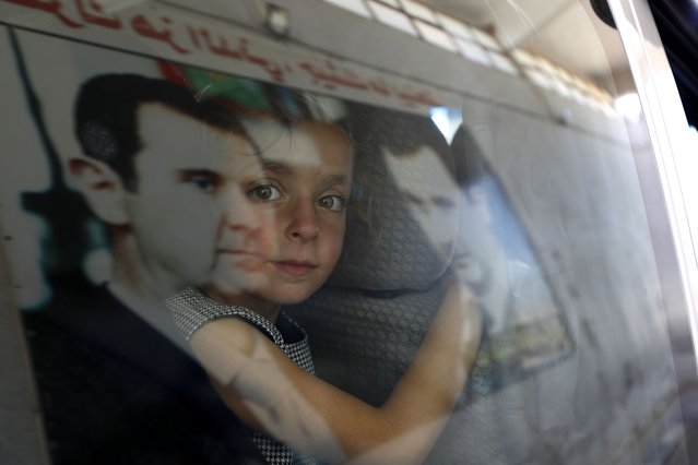 A Syrian girl fleeing the war in Lebanon with family, arrives at the Syrian-Lebanese border crossing in Jousieh, Syria, Tuesday, October 2, 2024. (Photo by Omar Sanadiki/AP Photo)