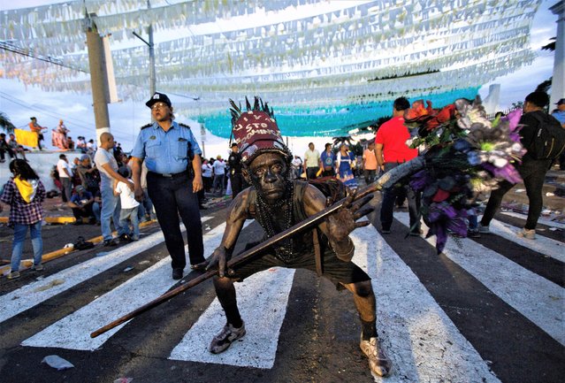 A man covered with motor oil takes part in celebrations honouring the patron saint of Managua, St. Dominic de Guzman, (Santo Domingo de Guzman), the largest celebration in the Central American country after Nicaragua's government allowed the popular festivities in Managua, Nicaragua on August 1, 2023. (Photo by Maynor Valenzuela/Reuters)