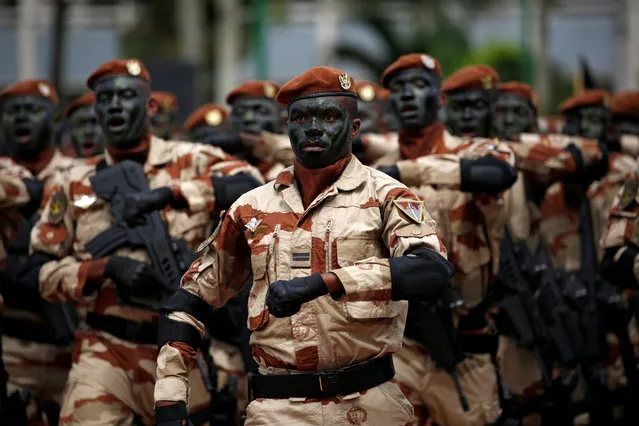 Ivory Coast's special force soldiers participate in a military parade to commemorate the country's 57th Independence Day at the presidential palace in Abidjan, Ivory Coast August 7, 2017. (Photo by Luc Gnago/Reuters)